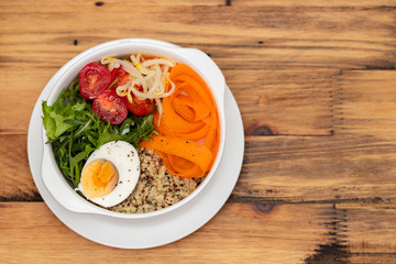 vegetables with boiled egg in white bowl