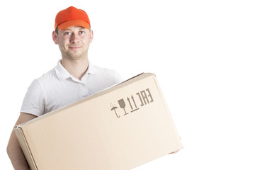 Courier worker delivery service in cap with cardboard box in hands isolated on white background. Portrait of a courier guy with parcel.