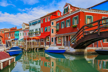 Fototapeta na wymiar Picturesque canal and colorful houses in Burano island near Venice Italy