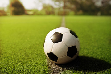 football on green grass or soccer field