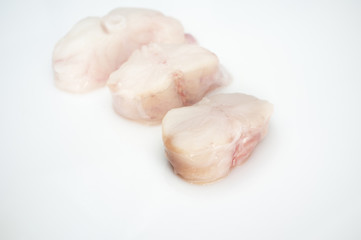 Monkfish tail steaks. Isolated over white