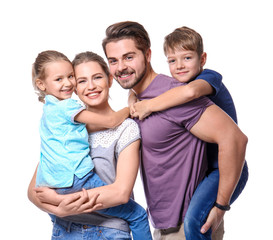 Portrait of couple with children on white background. Happy family