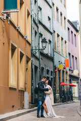 Fashion engagement shooting, photo session for beautiful couple, walk of a couple in love around the city and park.