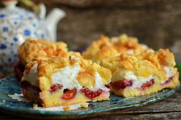 Square pieces of plum cake with crumble