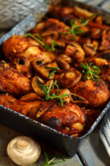 Golden baked chicken legs in a roasting pan
