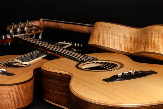 Acoustic guitars. Hand-made wooden classical and folk music instruments