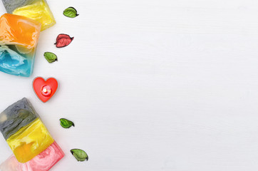 Spa concept background with copy space. Handmade solid soap and aroma  incense on white wooden table background.