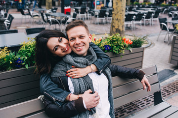 Fototapeta premium Fashion engagement shooting, photo session for beautiful couple, walk of a couple in love around the city and park.