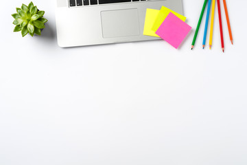 Laptop and accessories on white background with copy space