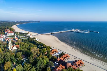 Wall murals The Baltic, Sopot, Poland Sopot resort in Poland. Wooden pier (molo) with marina, yachts, beach, old lighthouse, church, vacation infrastructure, hotels, park and promenade. Far view of Gdynia.  Aerial view at sunrise