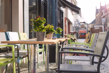 Tables with flowers in a cafe on the street. Travel in Europe. Netherlands