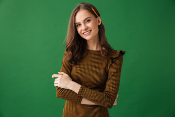 Happy young woman standing isolated