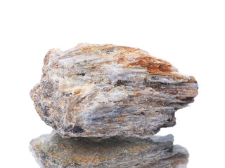 macro shooting of natural mineral rock specimen -  cyanite stone on an isolated white background,reflection