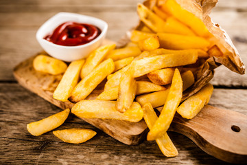 French fries on wooden table