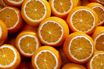 Colorful fruit pattern of fresh orange slices. From top view