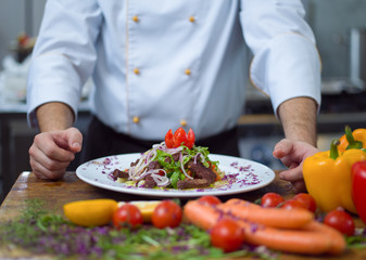 cook chef decorating garnishing prepared meal