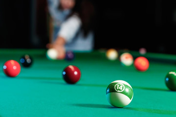 Billiard balls on the billiard table, American billiards. Sports games, outdoor activities.