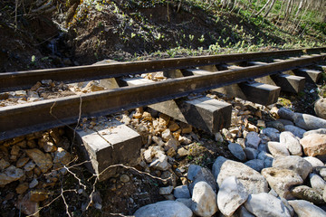 railroad washed away by a mountain stream, railroad hanging in the air