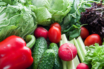 many kinds of greenery and vegetables lying on the table
