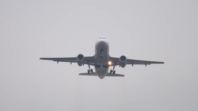 Airplane departure at rainy weather