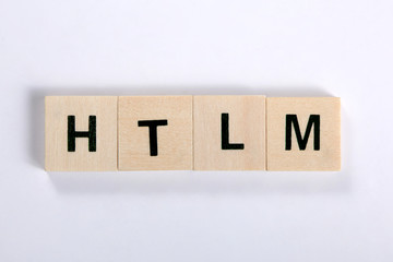 word htlm made of wooden block isolated on white background