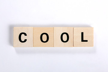 word cool made of wooden block isolated on white background