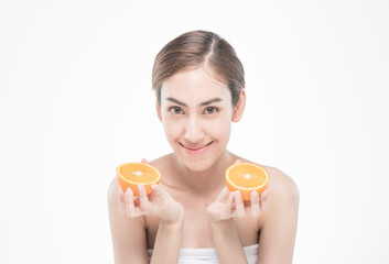  young woman holding juicy oranges before her face . Healthy eating concept. Diet. Isolated over white.
