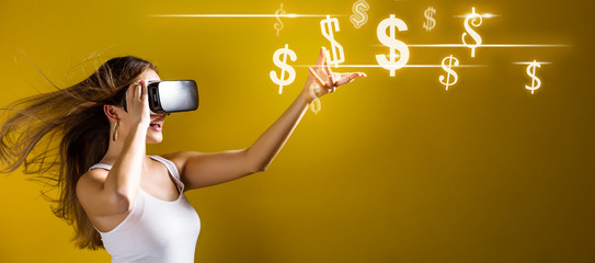 Dollars with young woman using a virtual reality headset