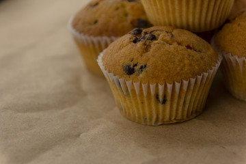 Homemade cupcakes with chocolate lit by the morning sun from the window.