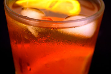Iced tea with lemon and orange. Refreshment. Close up