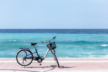Fototapeta premium Summer outdoor activities. Bicycle standing by the sea.