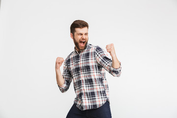 Fototapeta premium Portrait of a cheerful young man in plaid shirt