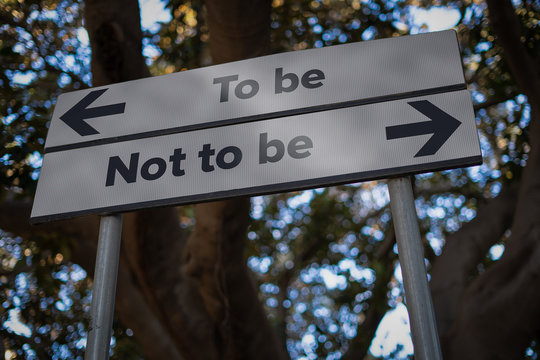 To be or not to be: road sign with opposite direction arrows. Problem or doubt thinking concept.