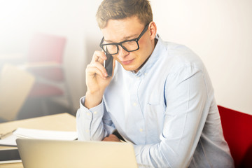 Office man talking by phone close up