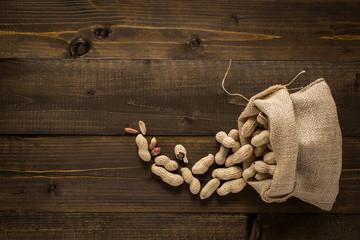 Peanuts in Shells on Wooden Background. Rustic Style.