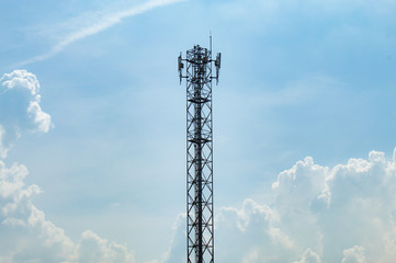 Wave transmission mast, large phone signal with a bright blue sky.