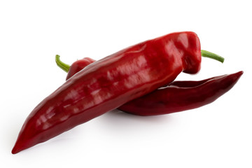Two Ramiro sweet pointed peppers isolated on white.