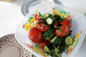 Pickled tomatoes and cucumbers salad