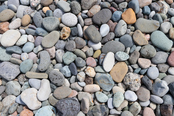 Smooth round pebbles textured background. Pebble sea beach close-up