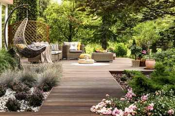 Wooden terrace surrounded by greenery - 204233351