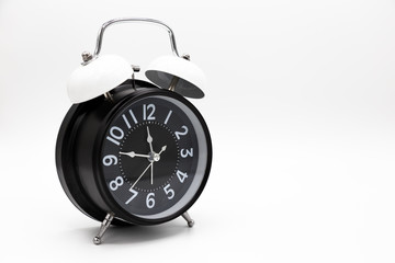 Closed up vintage analog clock isolated on white background.