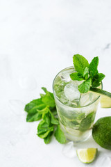 Classic alcohol cocktail mojito with rum, soda, lime and mint