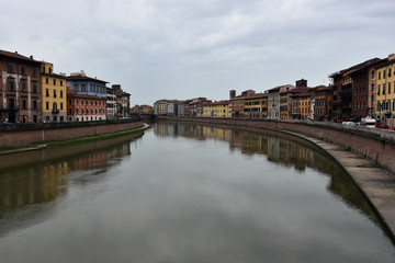 Fototapeta na wymiar Pisa and Arno River, Italy in a rainy day