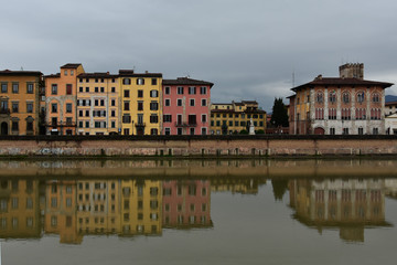 Fototapeta na wymiar Pisa and Arno River, Italy in a rainy day