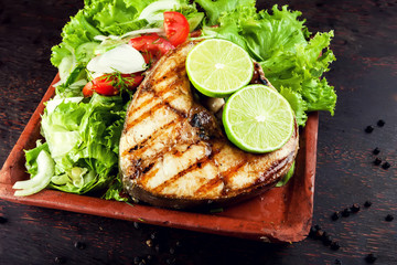 Grilled Fish Fillet with Vegetables in the plate
