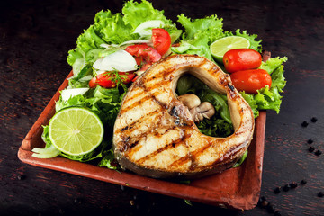 Grilled Fish Fillet with Vegetables in the plate