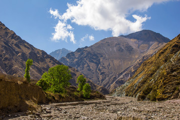 View of Iruya village and multicolored mountains in the surroundings at sunset, Salta province, Argentina, iruya - San Isidro - San Juan treeking