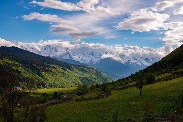 Obraz premium Countryside on green slopes of mountain valley