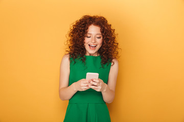 Portrait of a cheerful redhead woman in dress