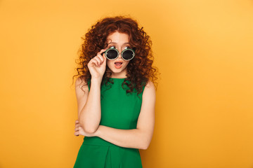 Portrait of a surprised redhead woman